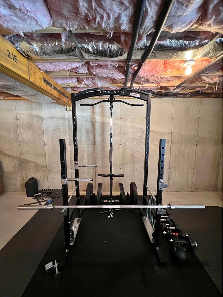Heavy Duty Power Rack System for Strength Training – All-in-One Home Gym Equipment with Integrated Cable Pulley and Barbell.