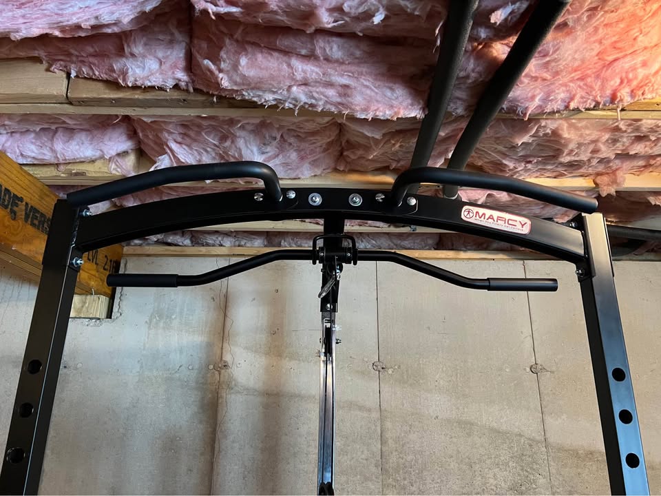 Heavy Duty Power Rack System for Strength Training – All-in-One Home Gym Equipment with Integrated Cable Pulley and Barbell.