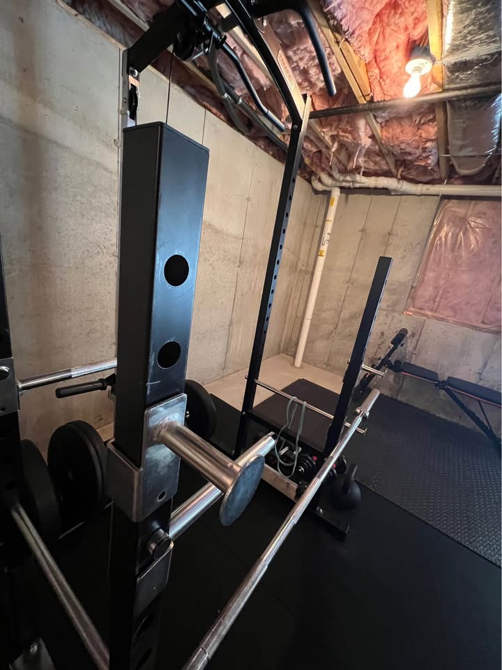 Heavy Duty Power Rack System for Strength Training – All-in-One Home Gym Equipment with Integrated Cable Pulley and Barbell.